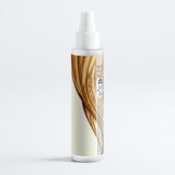 Hair product bottle with a wooden design on a white background