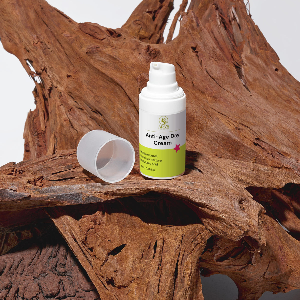 Anti-age day cream bottle with green label on a wooden surface