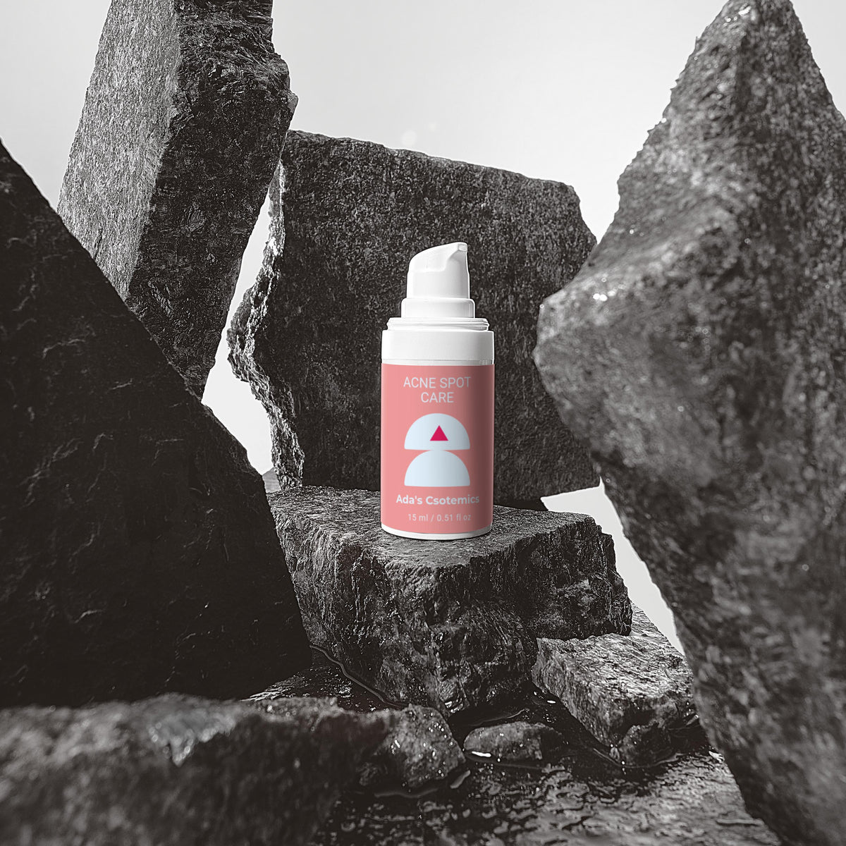 Pink spray can with a white nozzle on a black stone surface