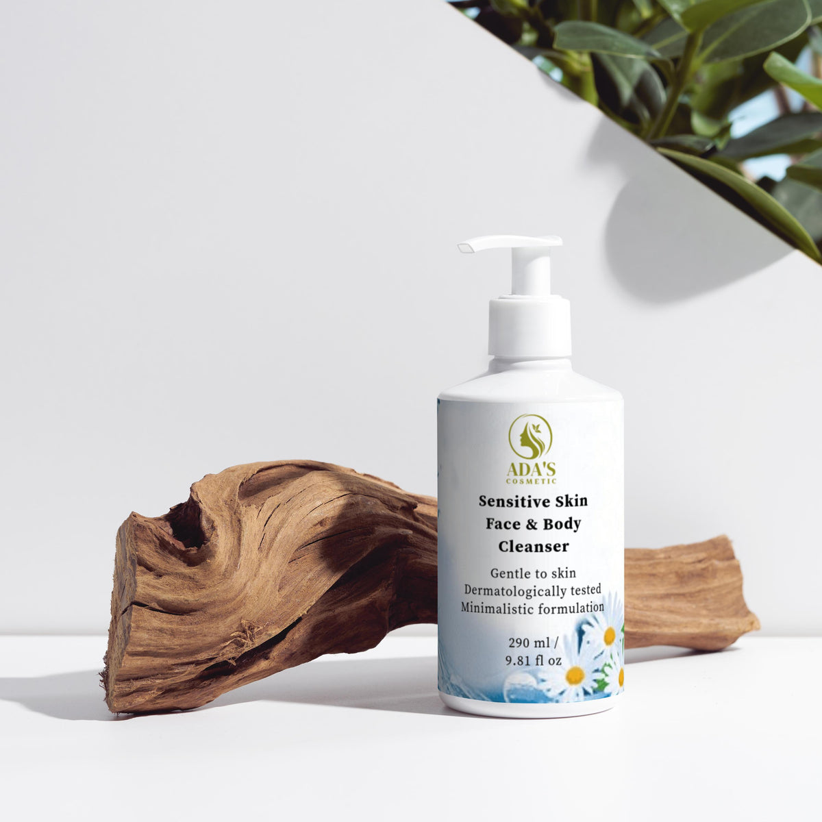 Bottle of sensitive skin face and body cleanser with natural elements on a white background